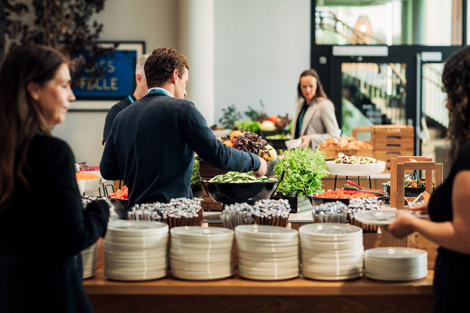 People helping themselves to the buffet in the canteen